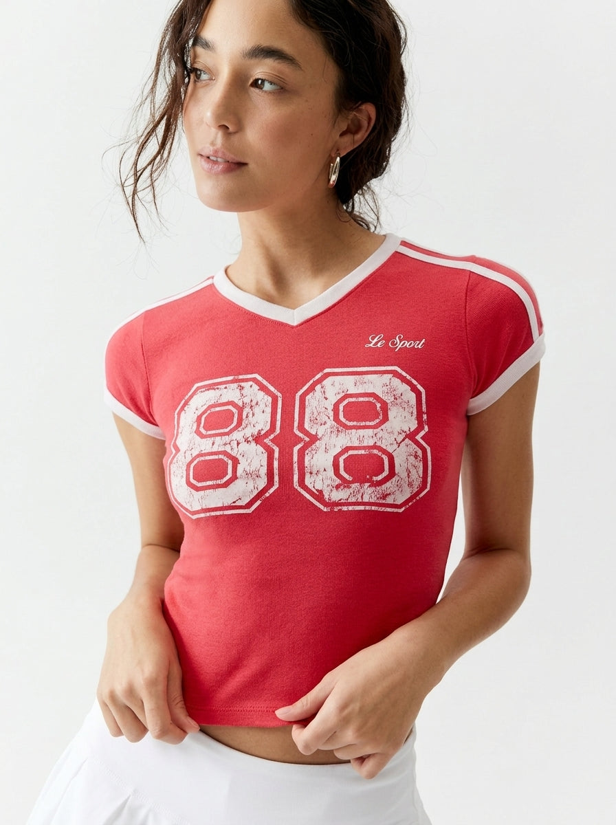 Urban Outfitters Le Sport Graphic Fitted Baby Tee in Red - Medium